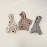 Soft and stylish Monica Hoodies in beige, cream, and gray, perfect for babies and toddlers. Ideal for cozy outings.